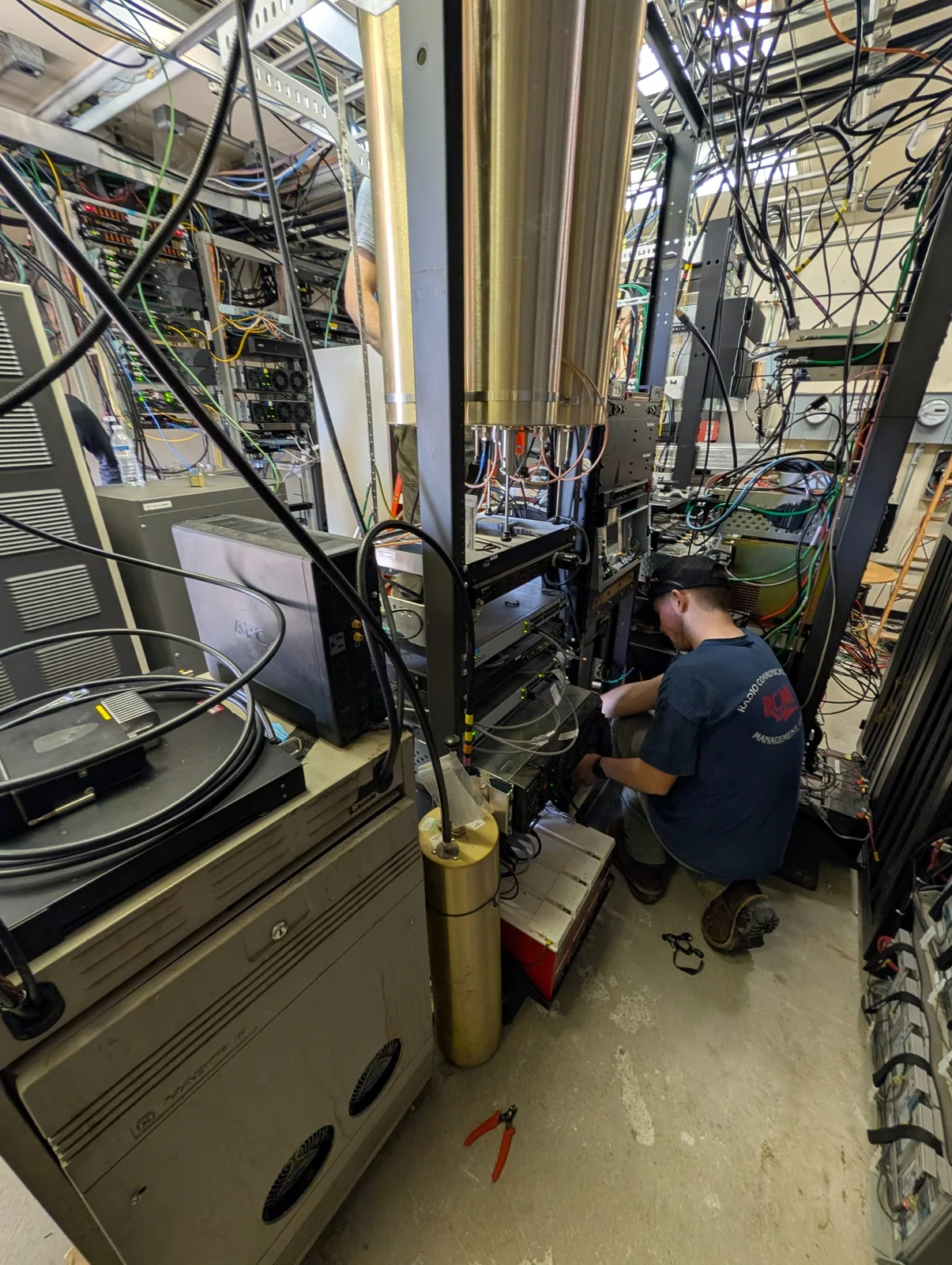 RCM technician working inside a radio equipment room